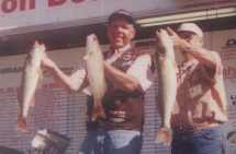 Rick LaCourse  and his amateur partner show off some Saginaw Bay Hog walleyes